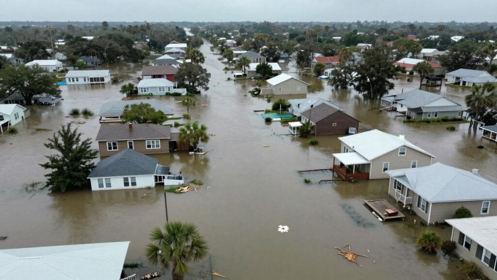Flooded Louisiana streets and homes after tropical storm.